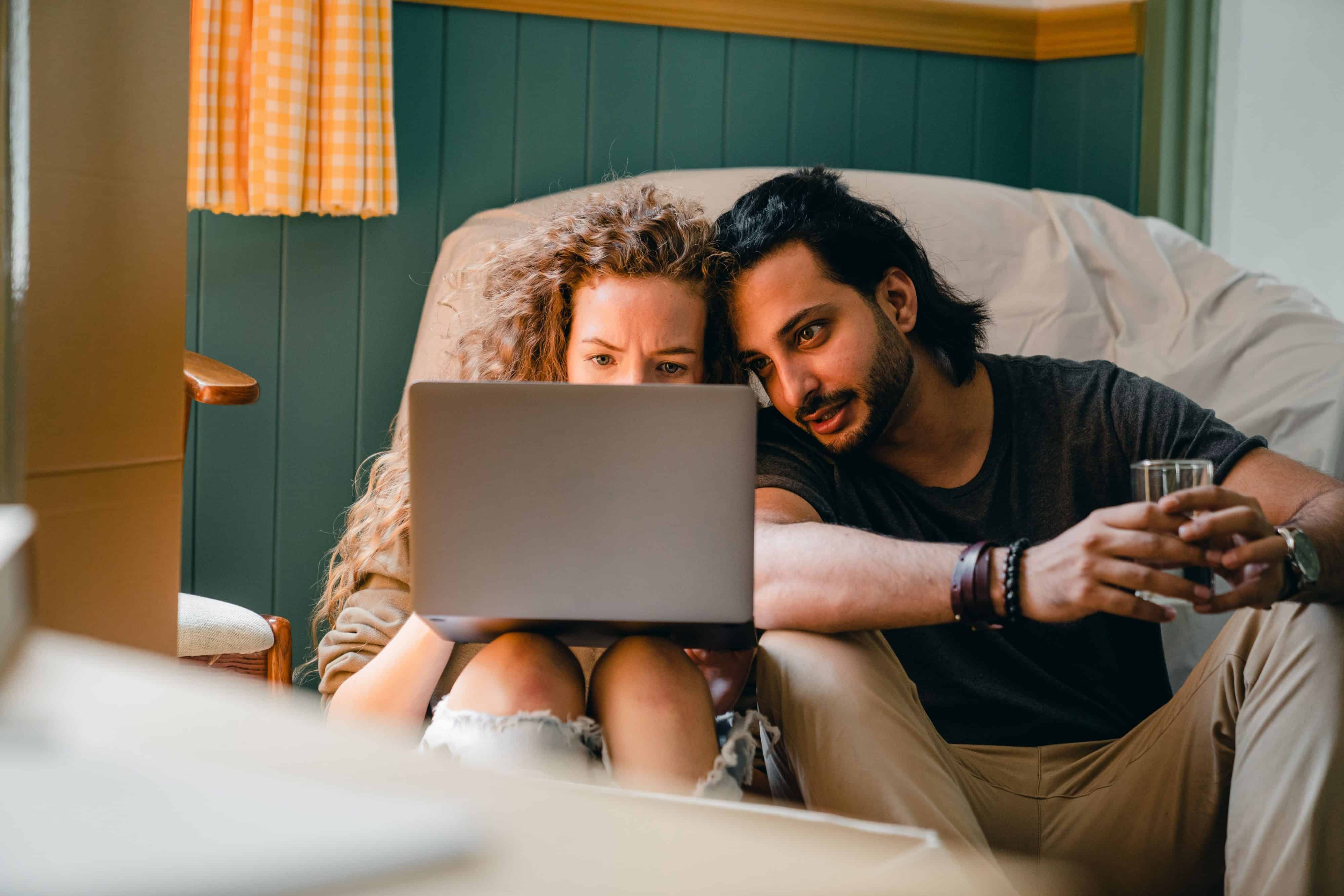 Man and woman sharing a laptop
